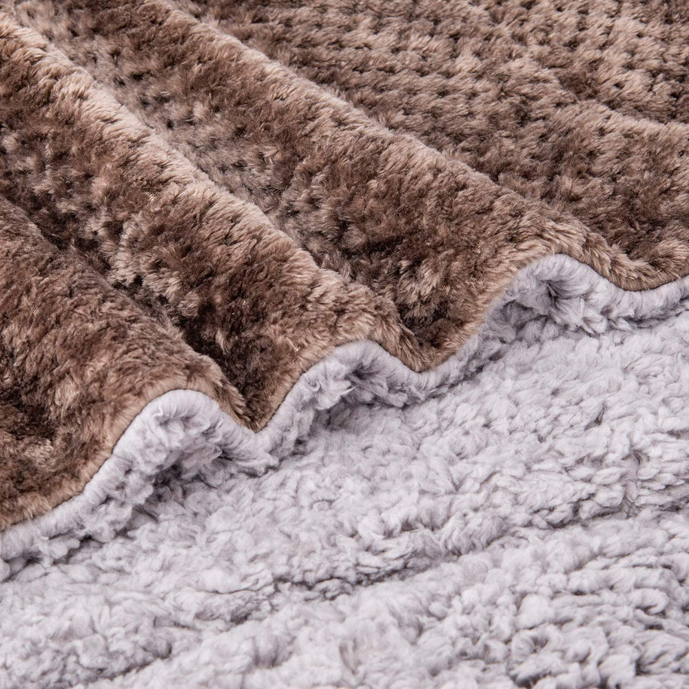 Wonder Miracle gray sherpa blanket close-up emphasizes all-season comfort and cozy indoor warmth.