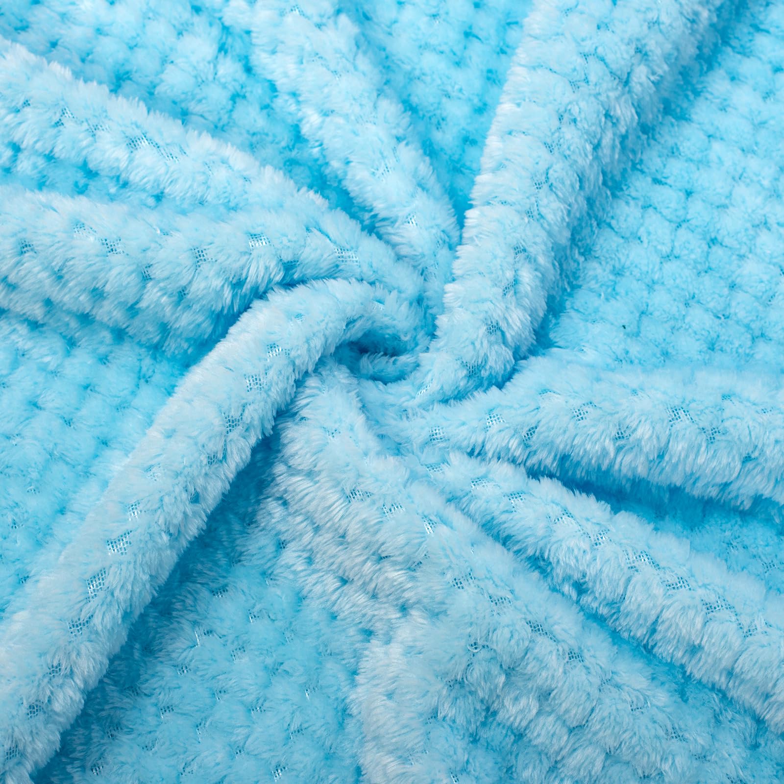 WONDER MIRACLE ice blue sherpa blanket folded for compact storage.