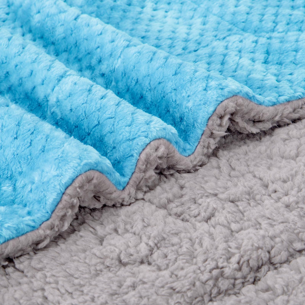 WONDER MIRACLE ice blue sherpa blanket in nursery decor with soft texture.