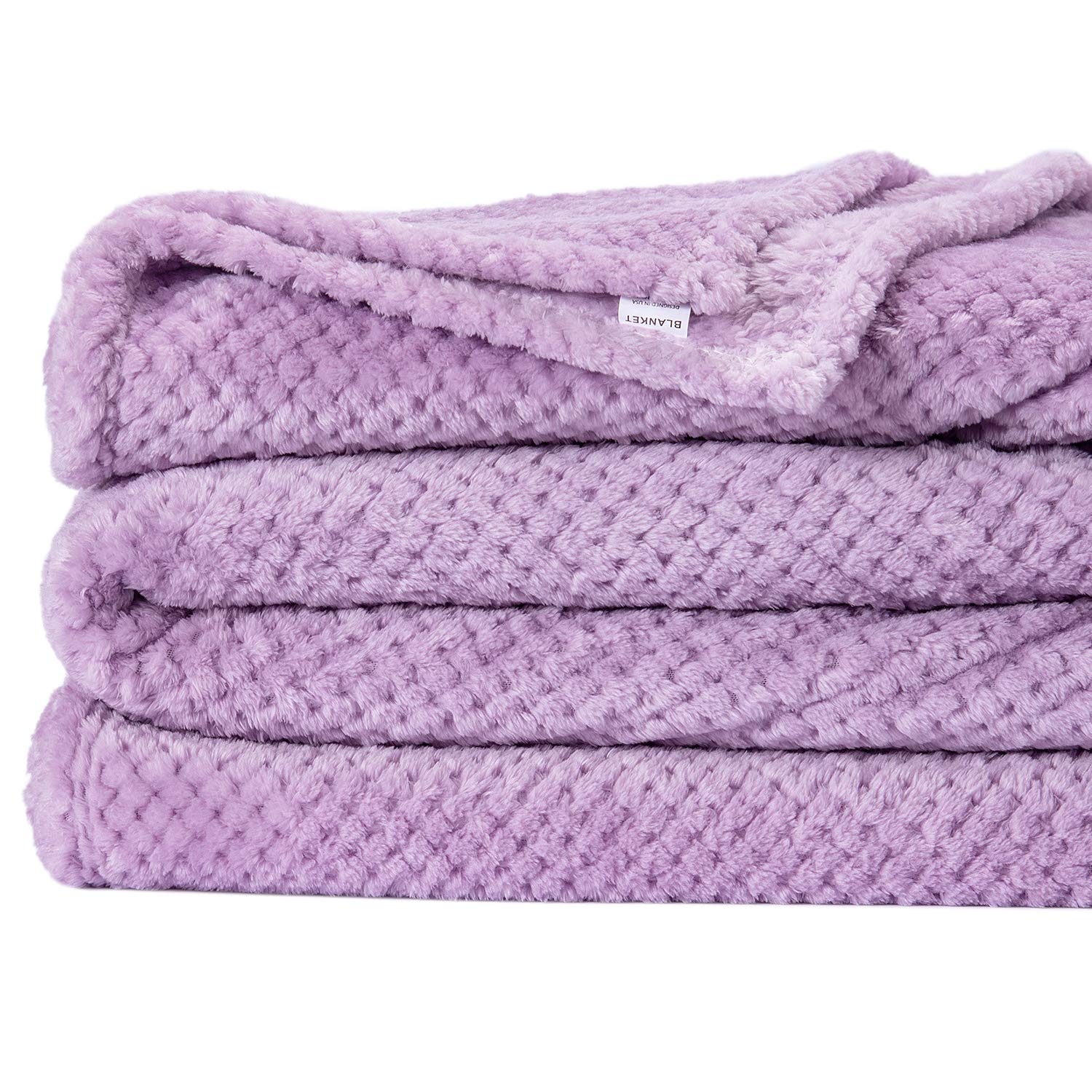 Wonder Miracle plush blanket lavender provides warm comfort on the couch or while traveling.