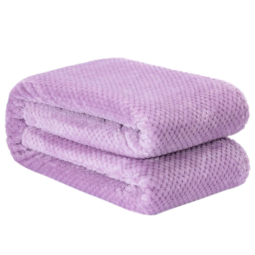 Wonder Miracle plush fleece blanket on couch for movie nights
