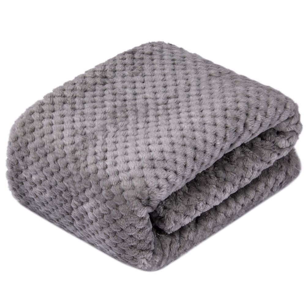 Wonder Miracle plush fleece blanket on a dog bed for warmth and comfort.