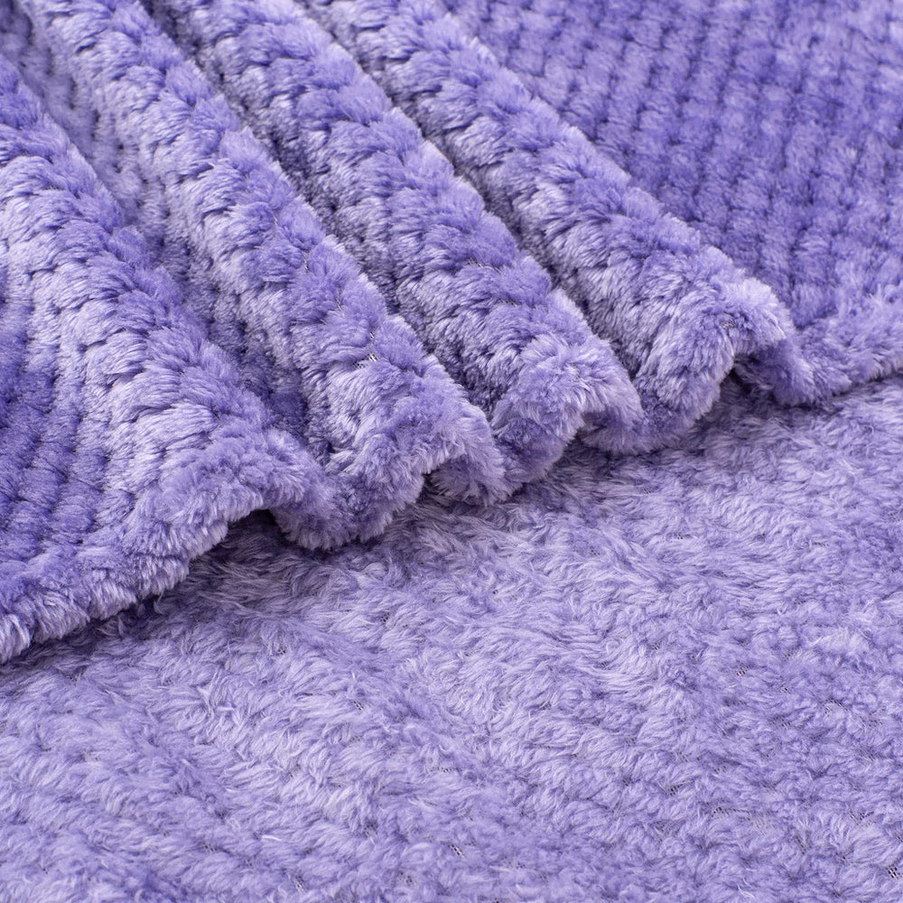 Wonder Miracle travel-compact blanket folds small for trips and car rides.