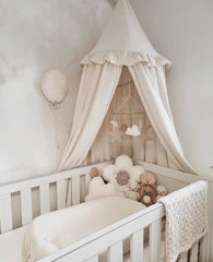Close-up of ivory ruffles on the Wonder Space canopy, soft and breathable.