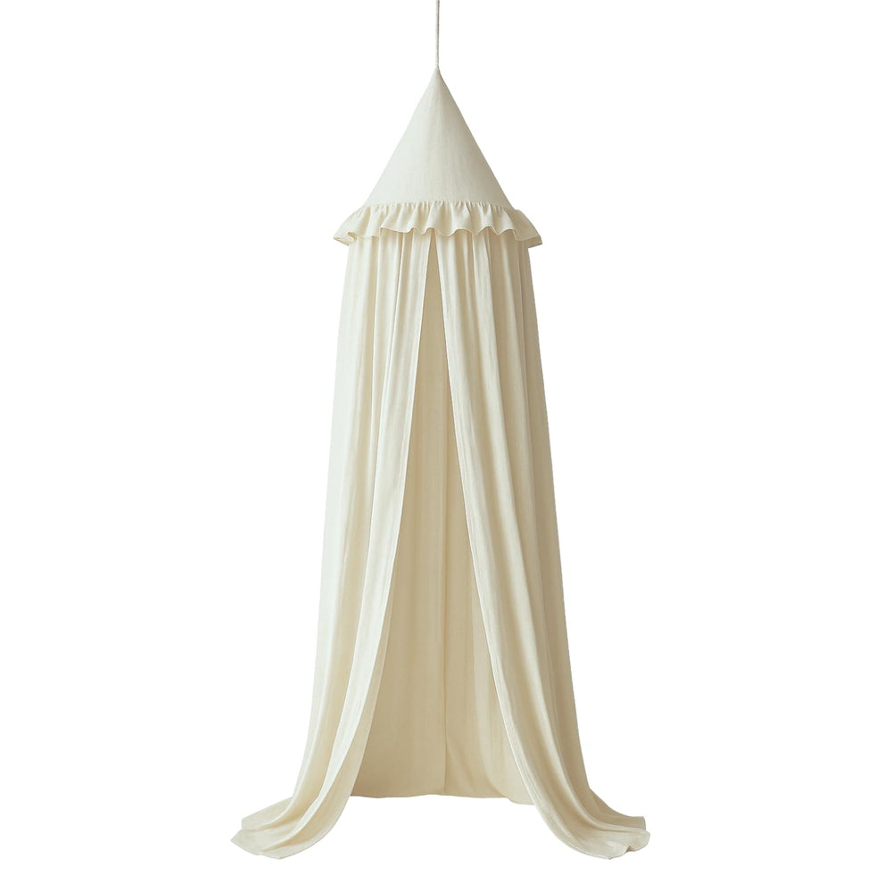 Wonder Space kids bed canopy with ivory ruffles over a cozy crib.