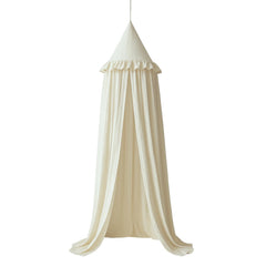Wonder Space kids bed canopy with ivory ruffles over a cozy crib.