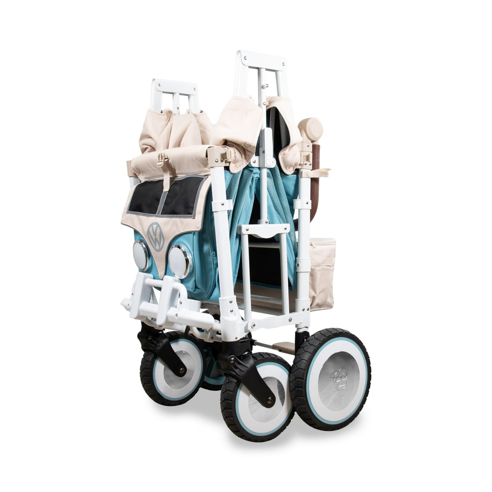 WonderFold VW wagon headlights on, aiding visibility during evening strolls.