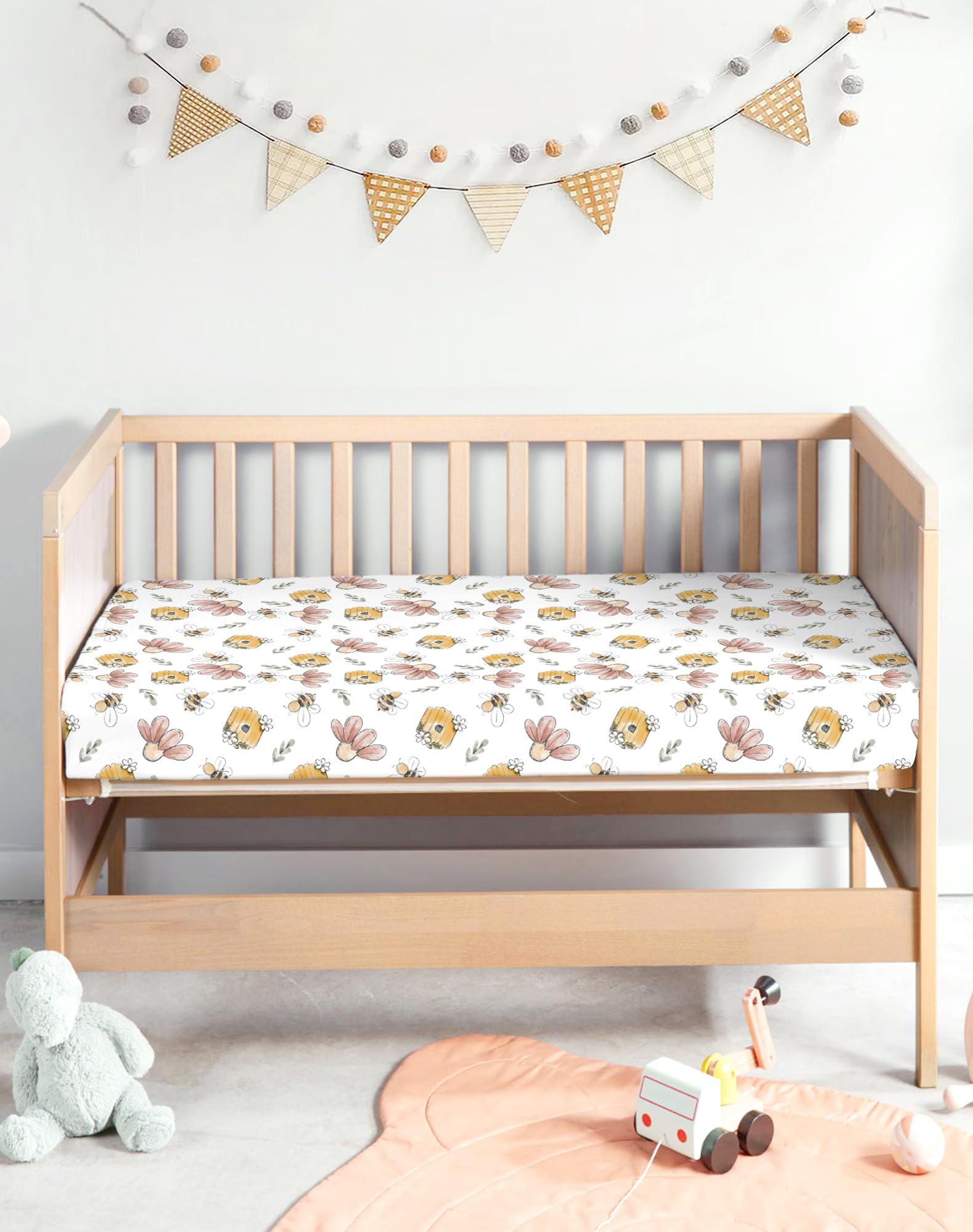 Woodiville 39x27 pack-n-play sheet close-up highlighting precise depth fit.
