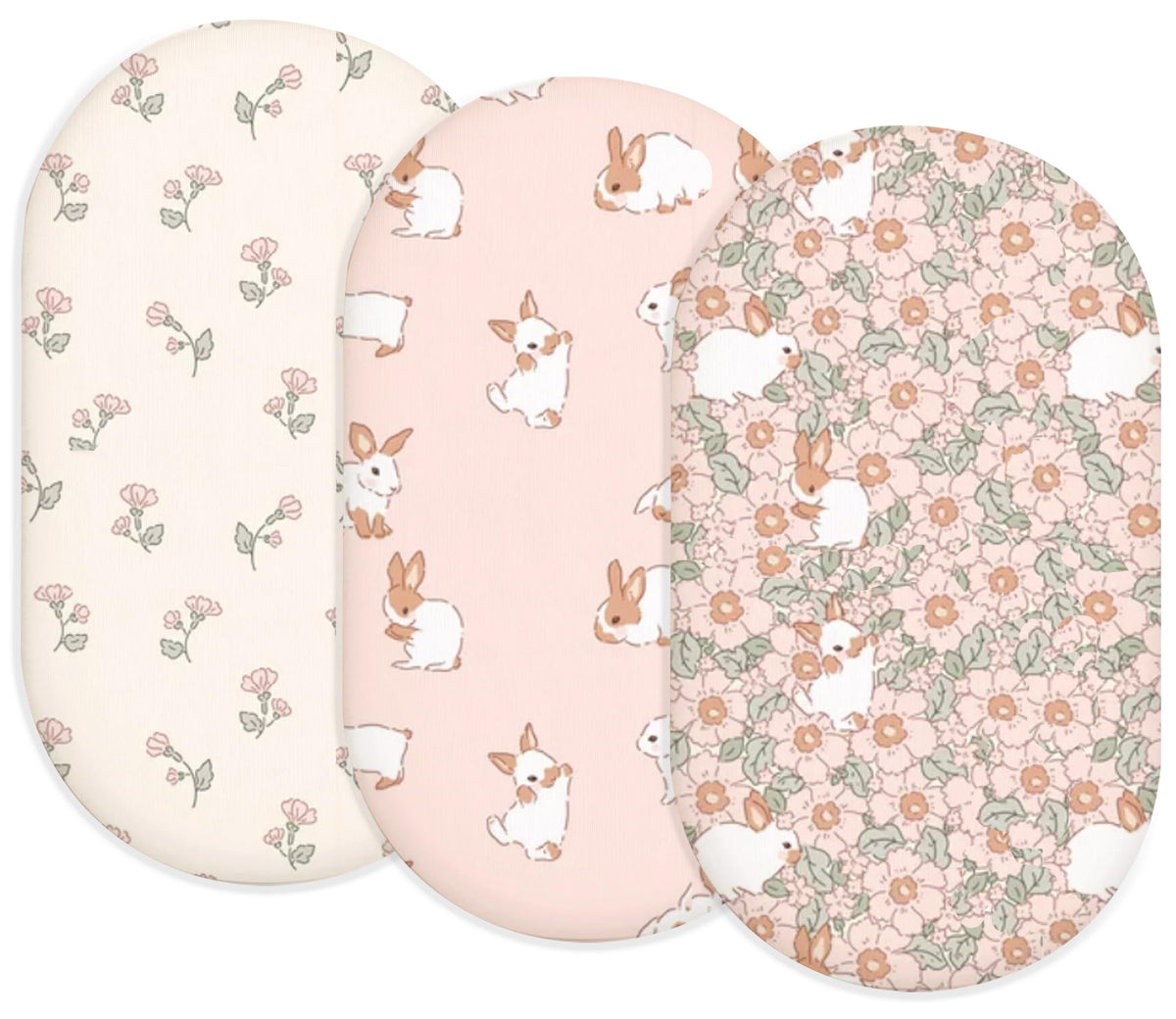 Woodiville Bassinet Sheets Blush Bunny two-pack on clean bed for newborn comfort