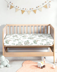 Woodiville crib sheet with secure elastic band to stay in place during sleep