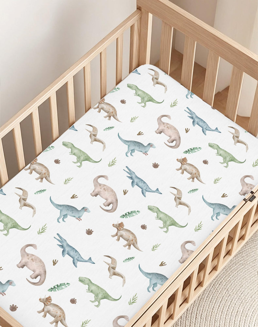 Woodiville Dino Pals crib sheet is foldable and machine washable for busy families.
