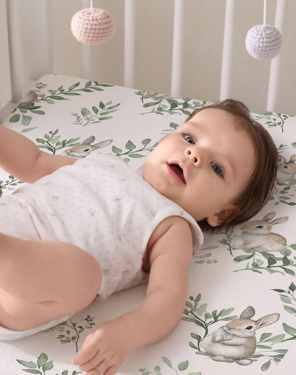 Woodiville nature-inspired patterns suit neutral nursery decor.