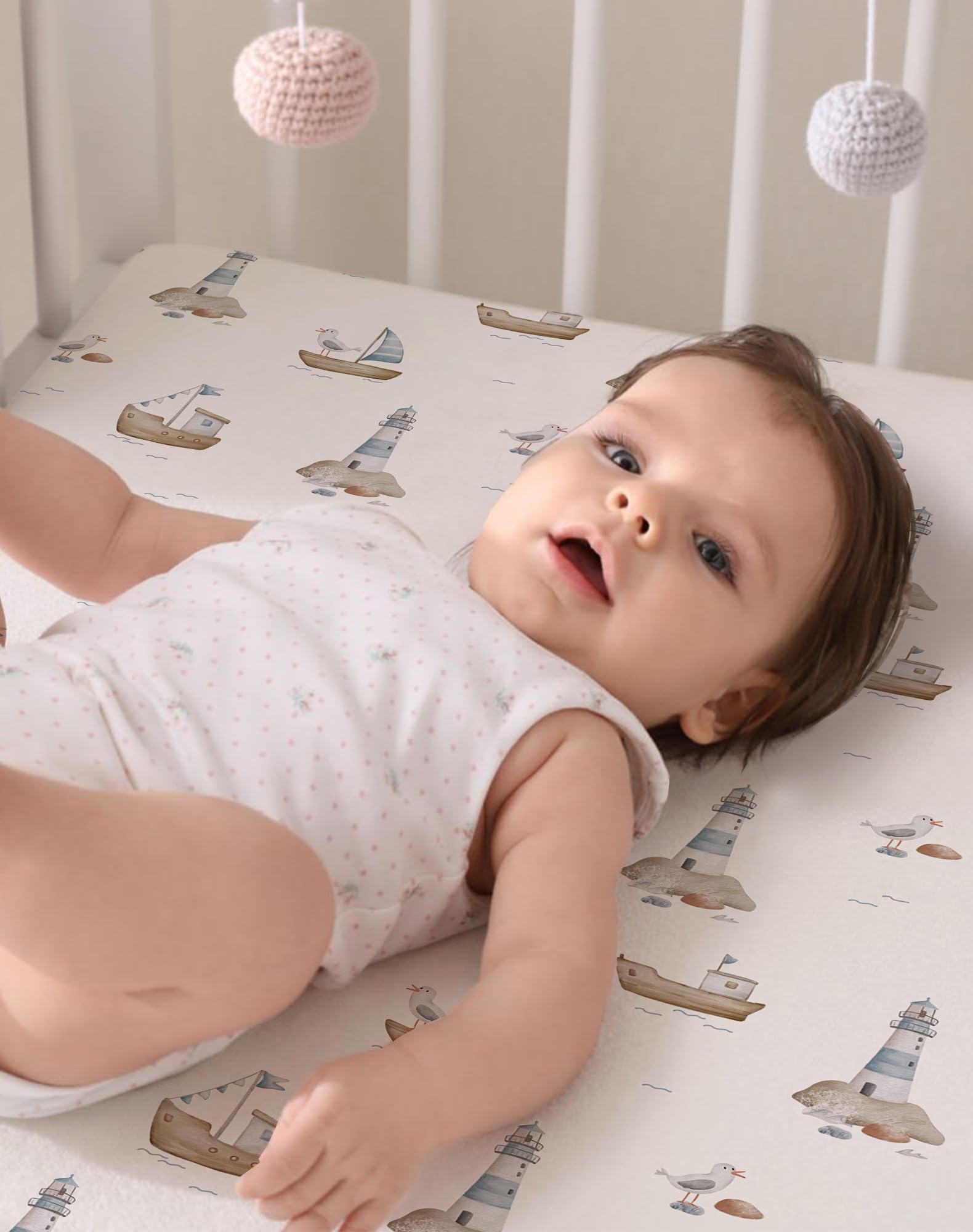 Woodiville Pack N Play Sheets Elastic band holds sheet flat during play.