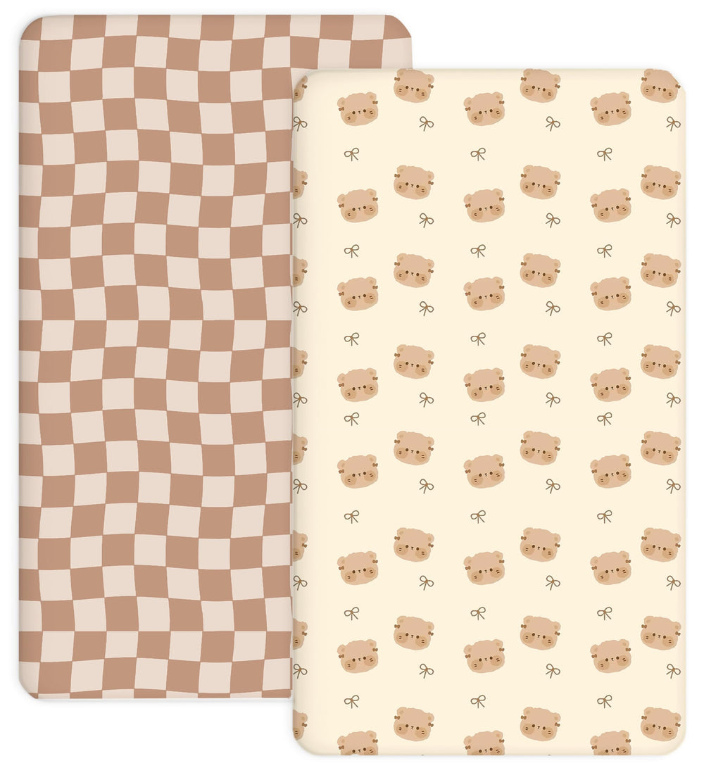 Woodiville Teddy Bow crib sheet close-up showing secure elastic edge for a snug fit.