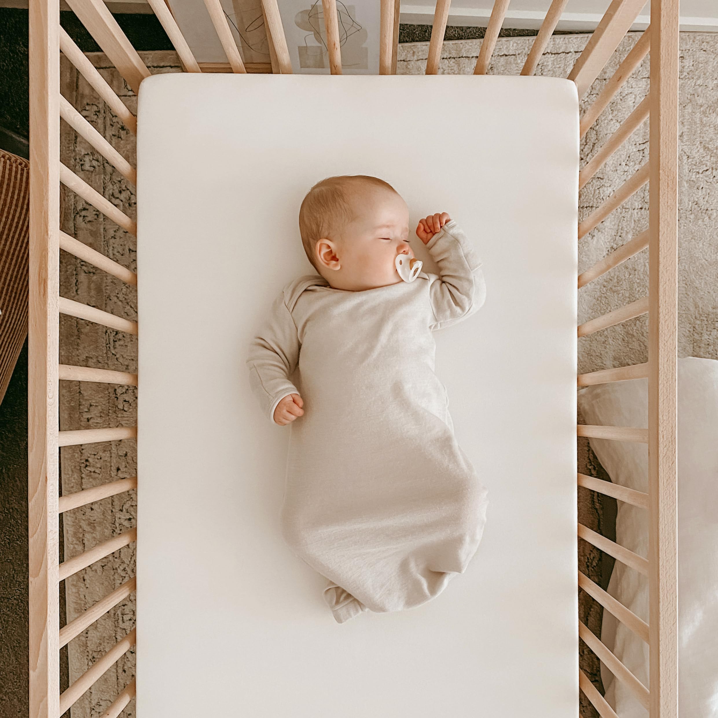 Woolino infant nightgown fold-over cuffs prevent scratching while soothing sleep.