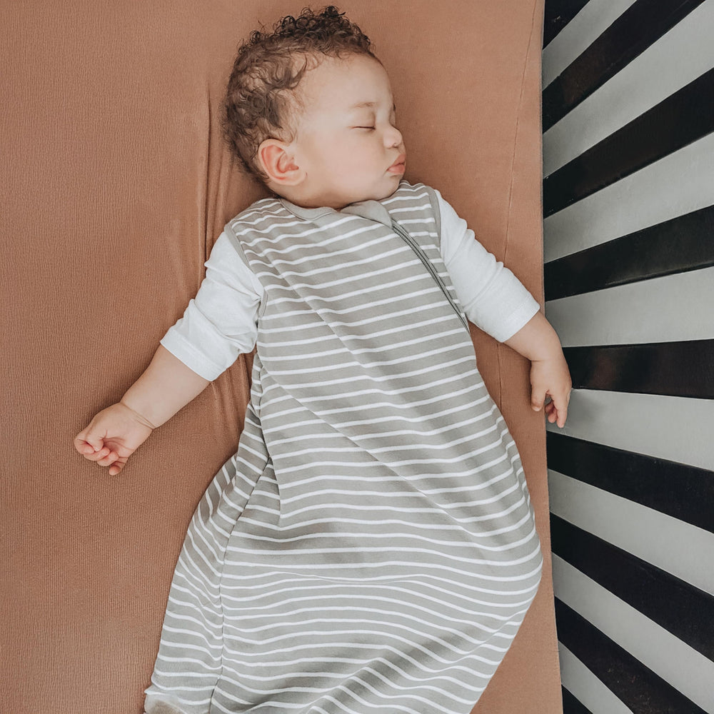 Woolino Merino sleep bag flat on bed illustrates generous size.