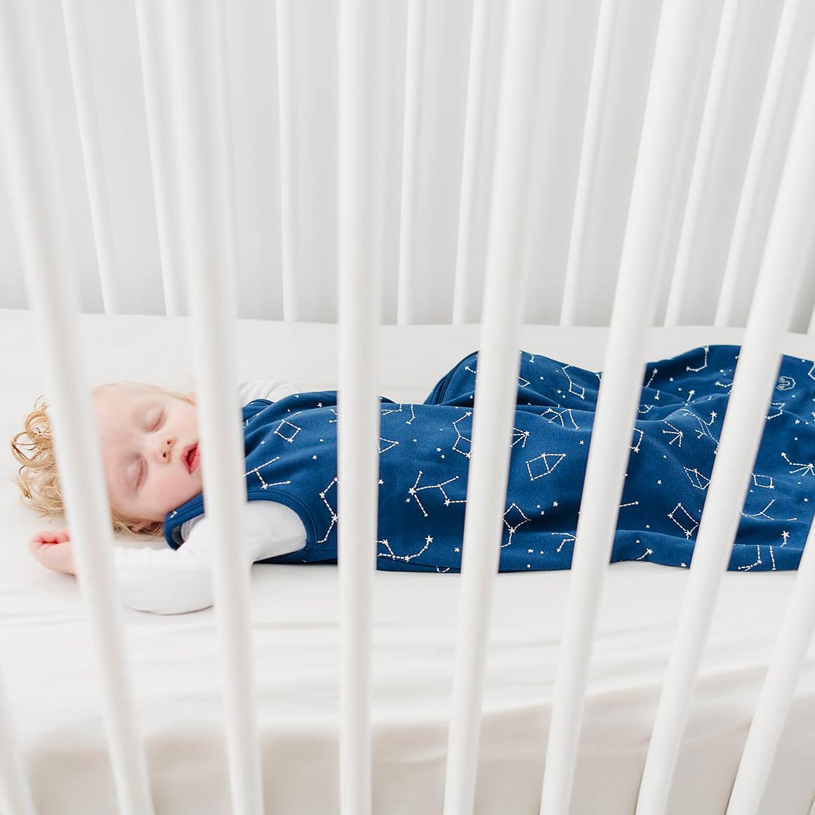 Woolino nursery thermometer and guide included near the sleep bag