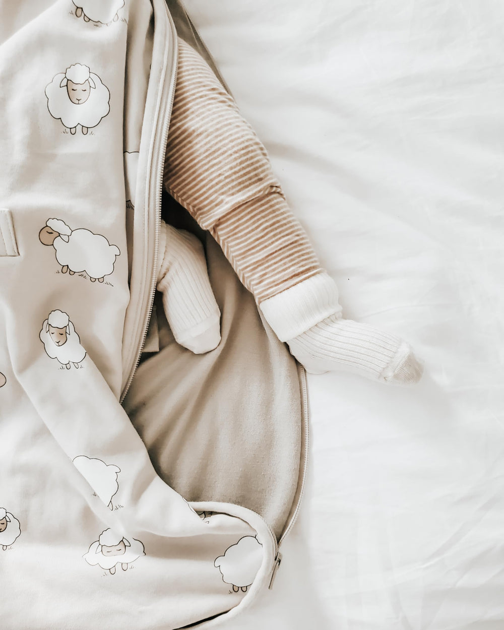 Woolino seatbelt slots enable safe transfers from stroller to crib.