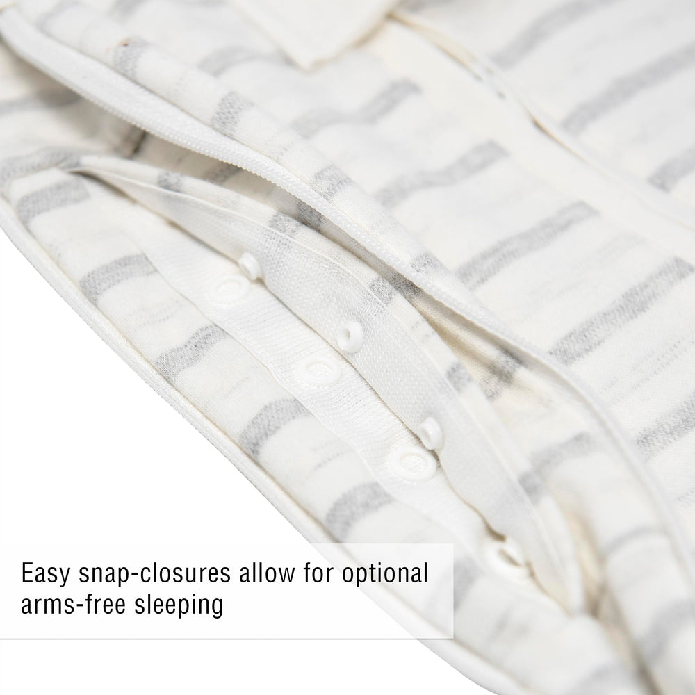 Woombie Grow With Me zippered swaddle allows quick diaper changes.