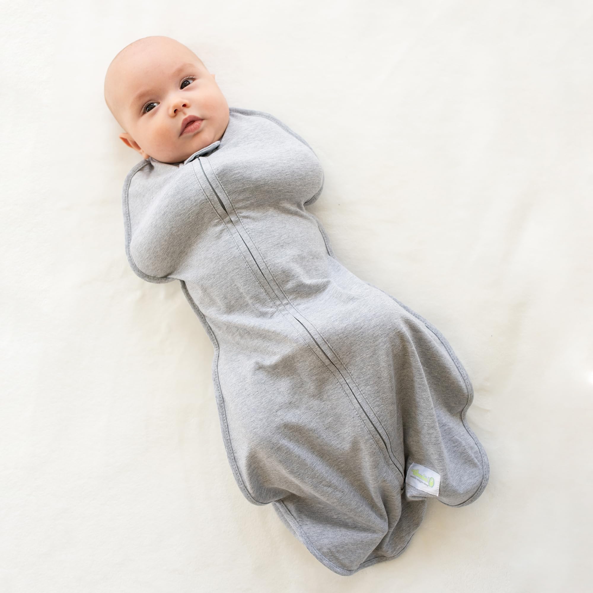 Woombie Original hip-healthy swaddle design highlighting ergonomic fit
