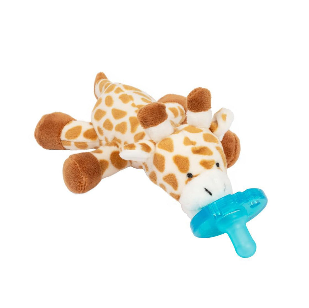 Wubbanub Giraffe pacifier in a bedtime setup for soothing comfort