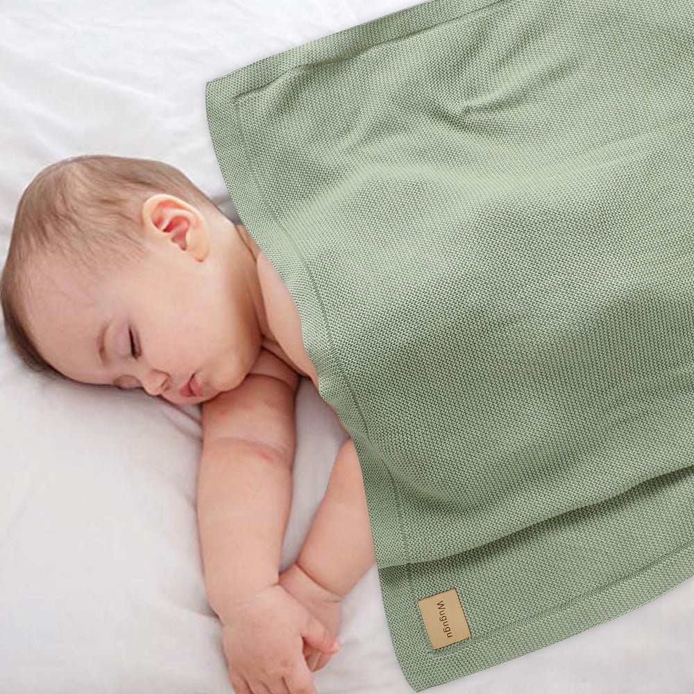 Wugugu baby blanket laid out for cozy snuggle during tummy time