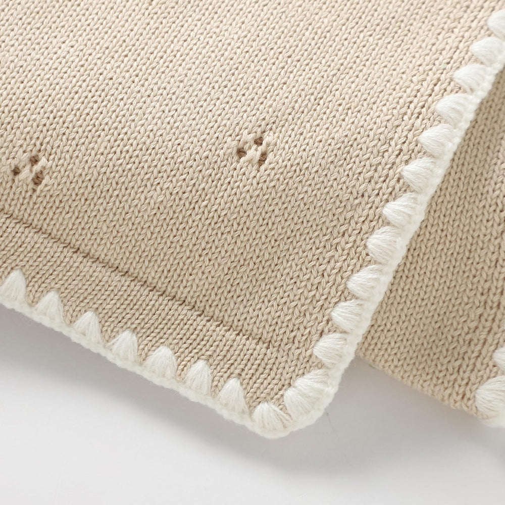 Wugugu baby swaddle wrap knit offers versatile use from nap time to play.