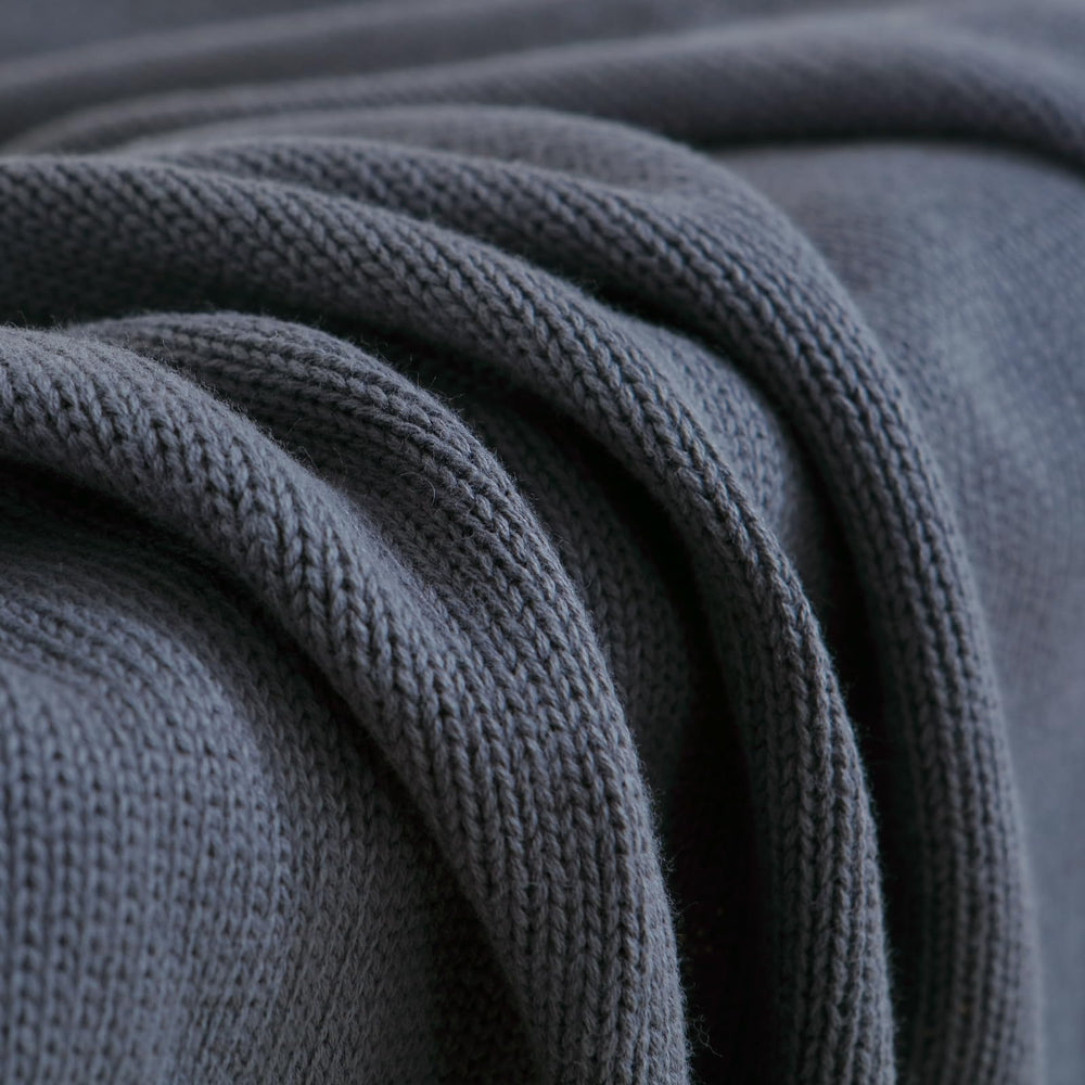 WZOWZO knit baby blanket placed on stroller for on-the-go warmth.