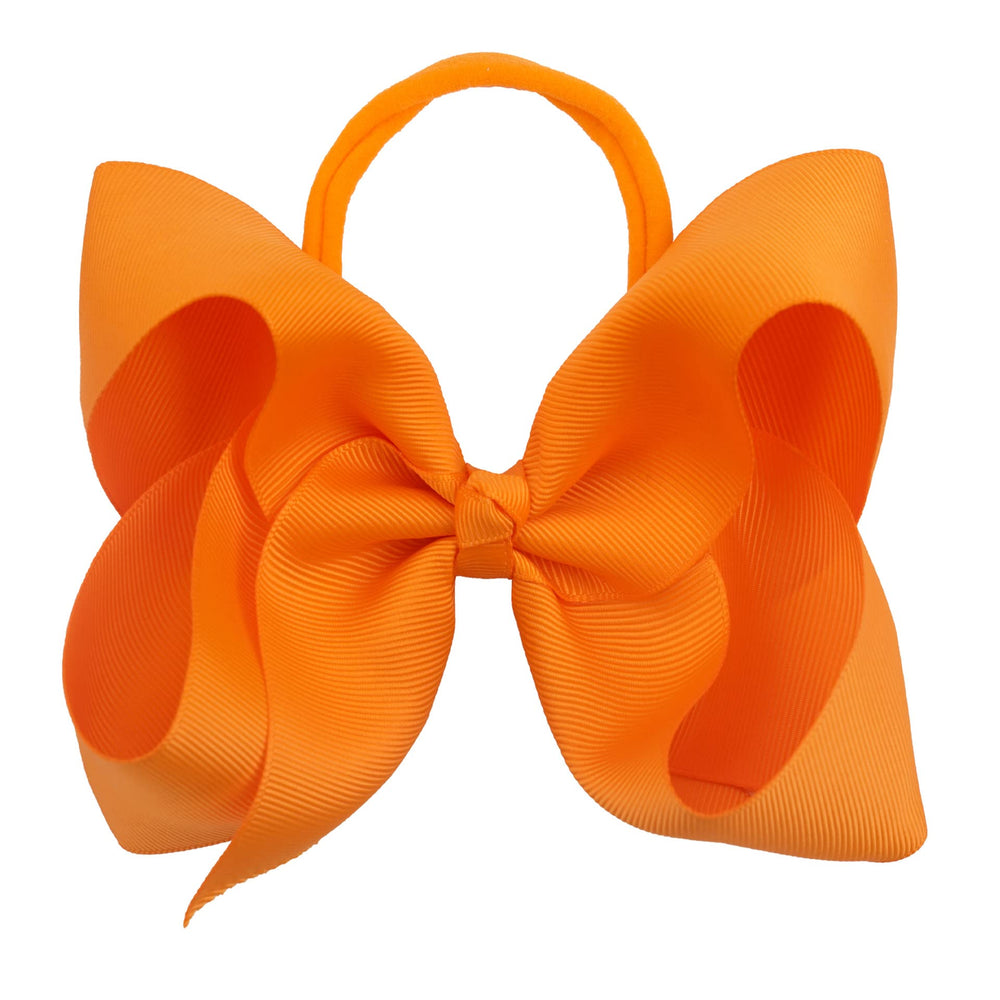 Xansema ribbon bow headband showcases a bold orange accent for photos.
