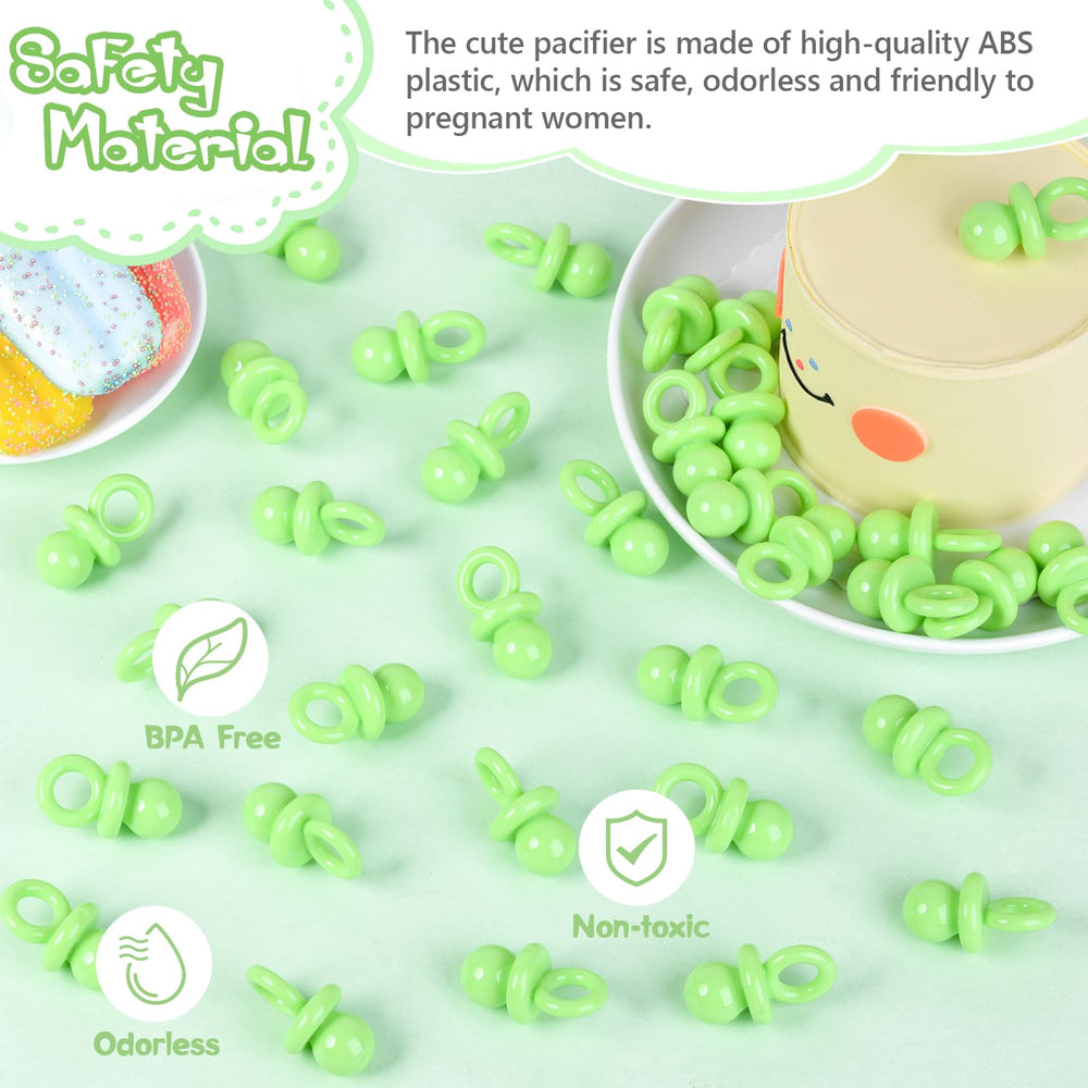 XINHUIDALSQ green pacifiers in a gender reveal setup for play