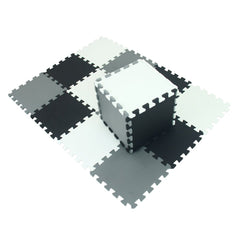 XMTMMD interlocking foam tiles forming a colorful puzzle play area for kids.