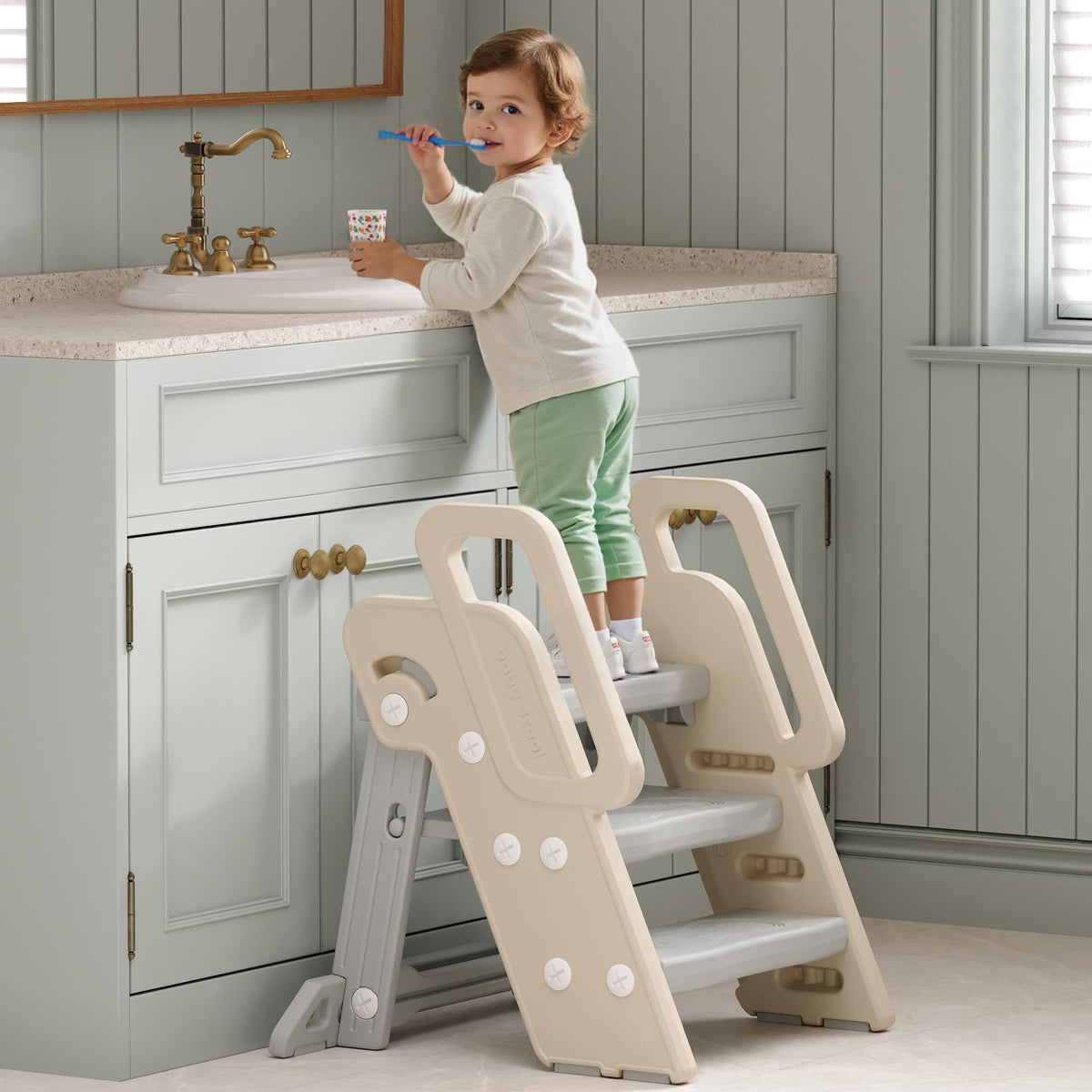XQIAO foldable step stool beside the bathroom sink supports toddlers safely.