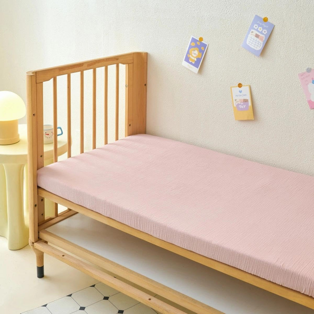 Two-pack Xuan Dian muslin sheets provide easy rotation for busy parents