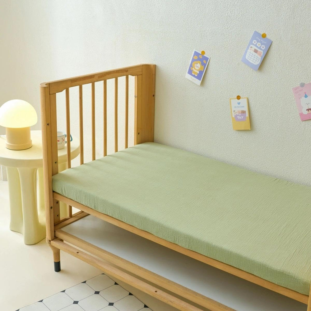 Xuan Dian Muslin crib sheets machine washable label, easy care and color retention.