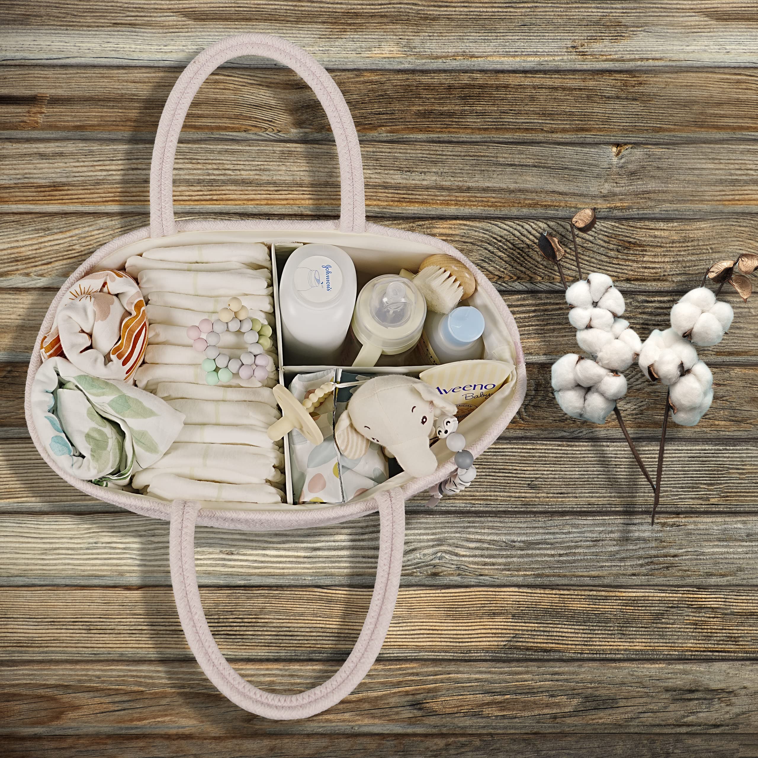 Xuanguo diaper caddy pink on changing table, keeping essentials accessible.
