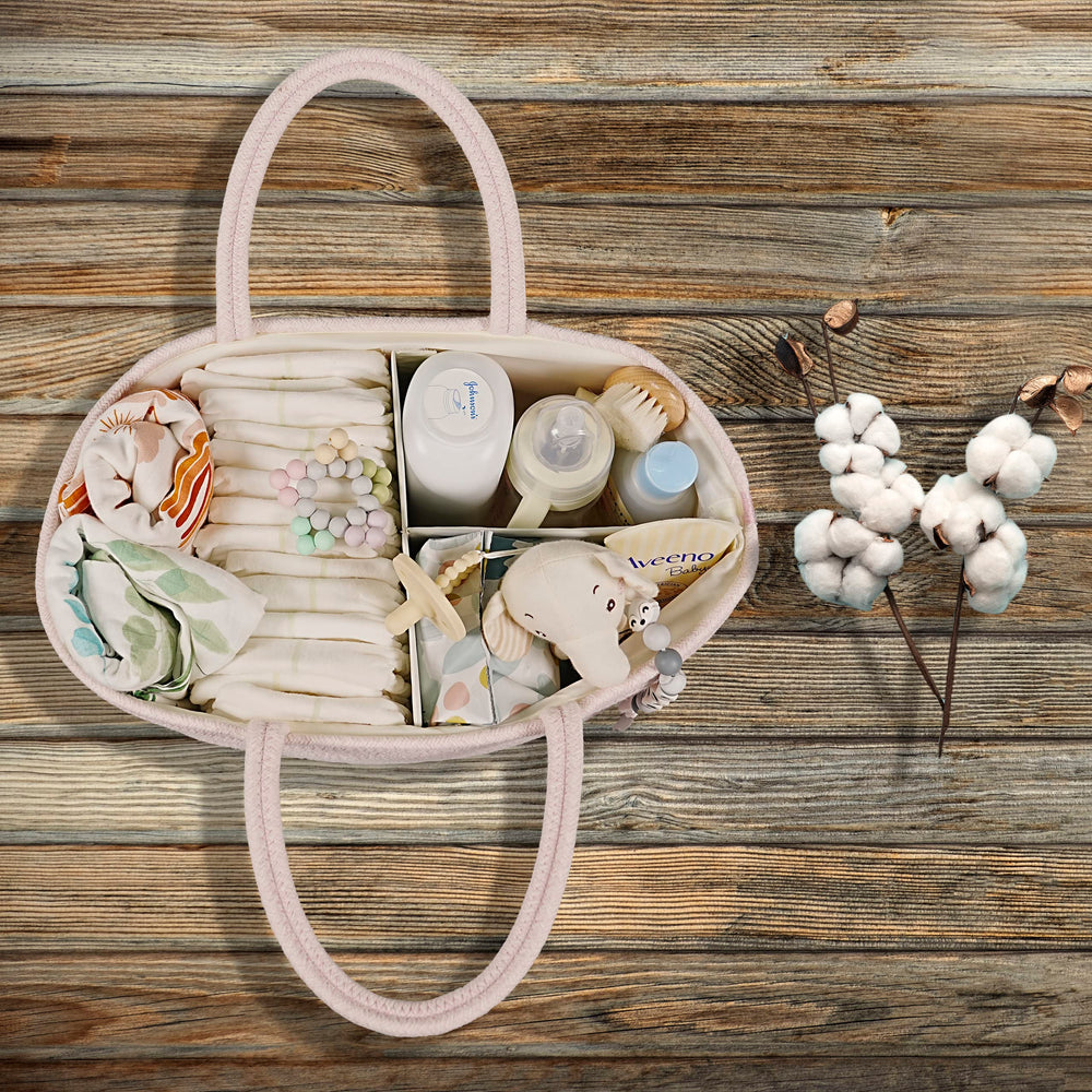 Xuanguo diaper caddy pink on changing table, keeping essentials accessible.