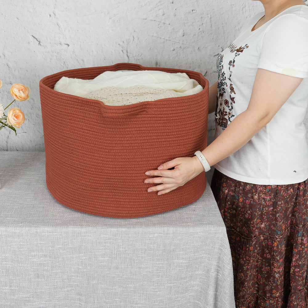 XUANGUO woven laundry basket keeps clothes tidy with sturdy handles.