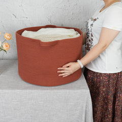 XUANGUO woven laundry basket keeps clothes tidy with sturdy handles.