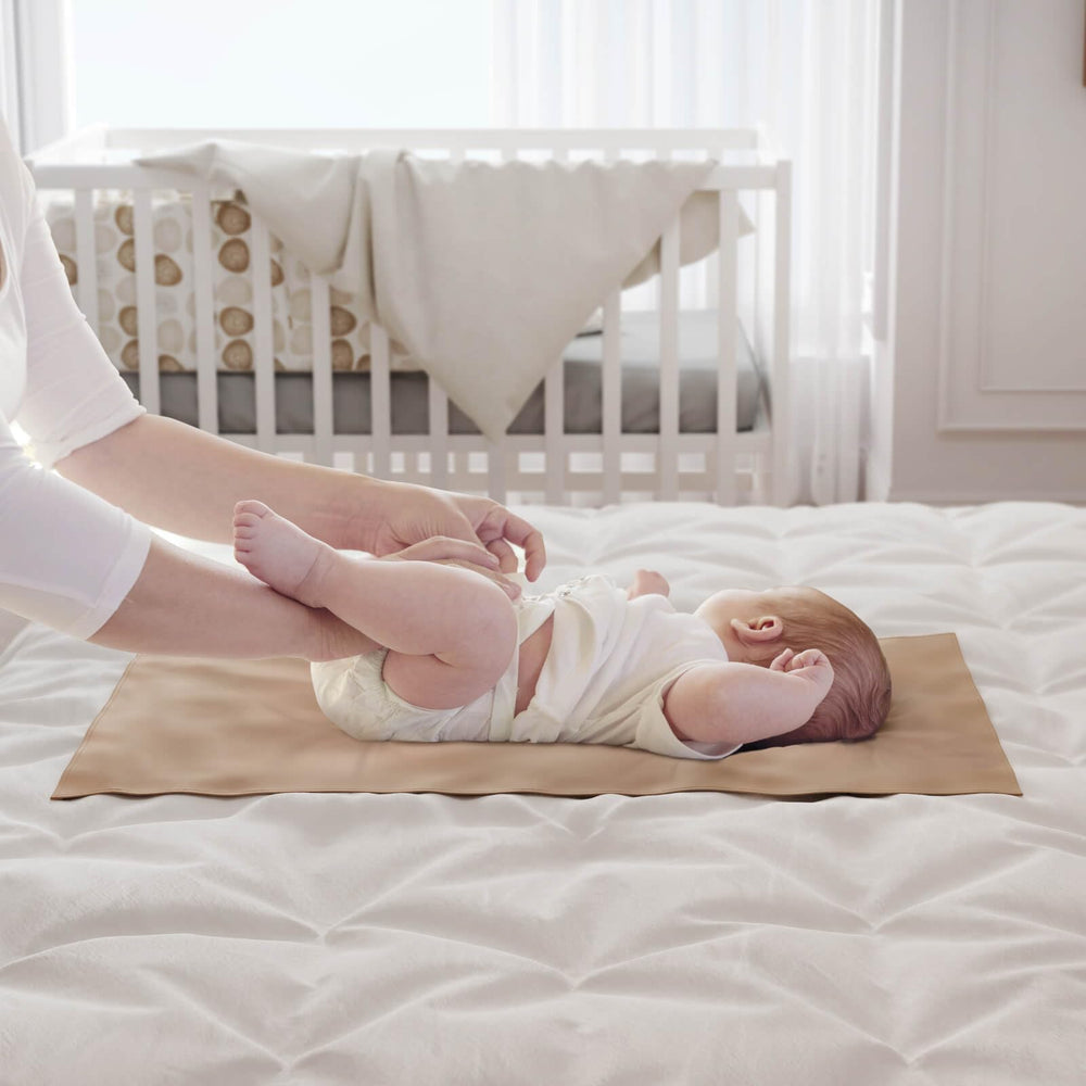 YACODAVO waterproof changing pad easily wipes clean after spills.