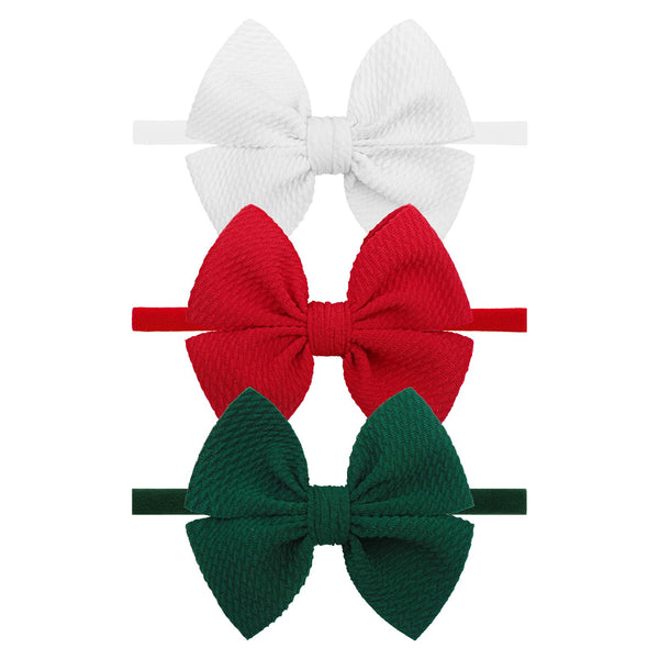 YanJie 4'' Christmas bows headband on newborn, soft and secure.