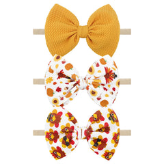 YanJie ginger yellow bow on a soft headband, ideal for Thanksgiving outfits.