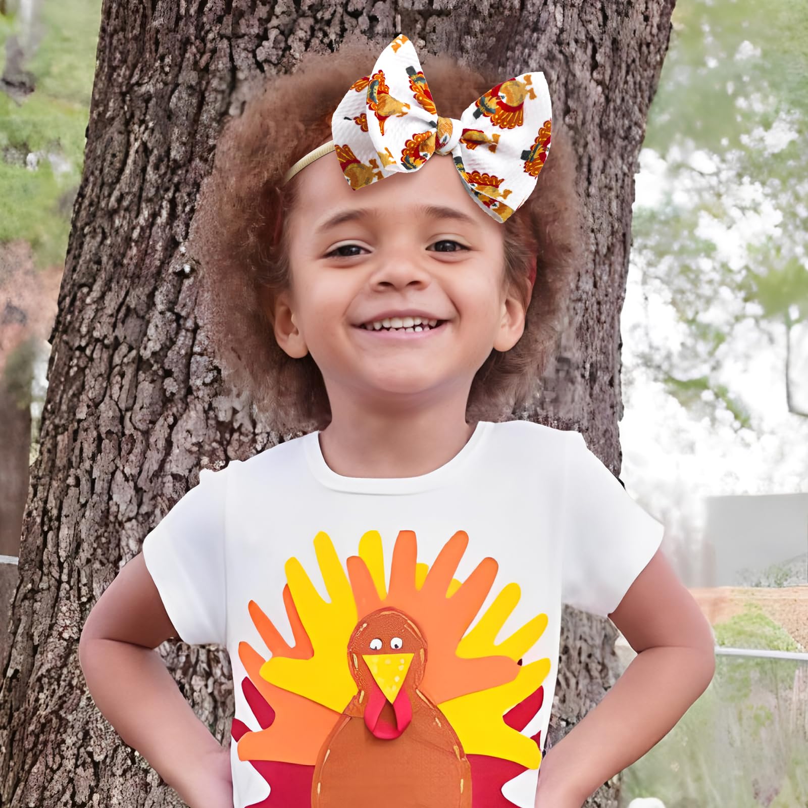 YanJie turkey-print baby bow enhances cute holiday looks.