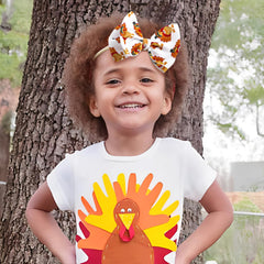 YanJie turkey-print baby bow enhances cute holiday looks.