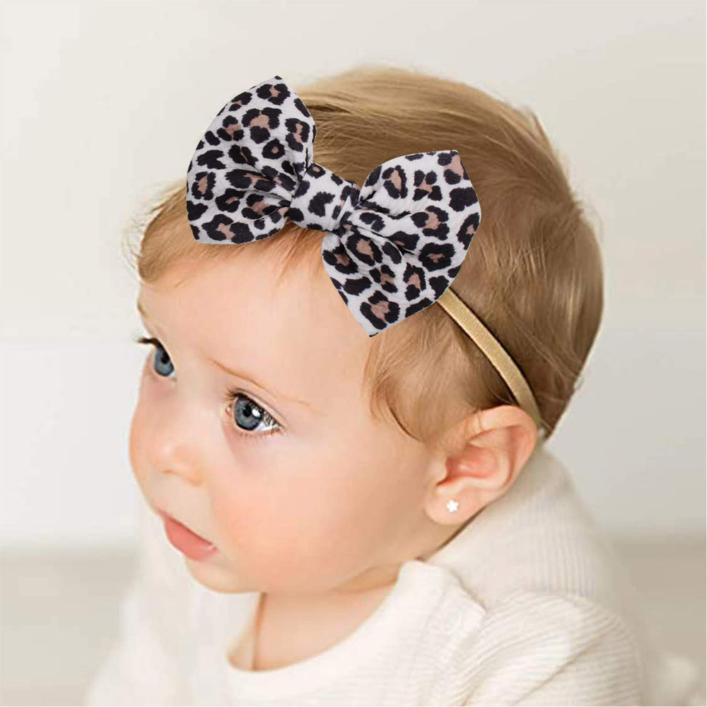 YanJie newborn headband close-up on skin-friendly material.