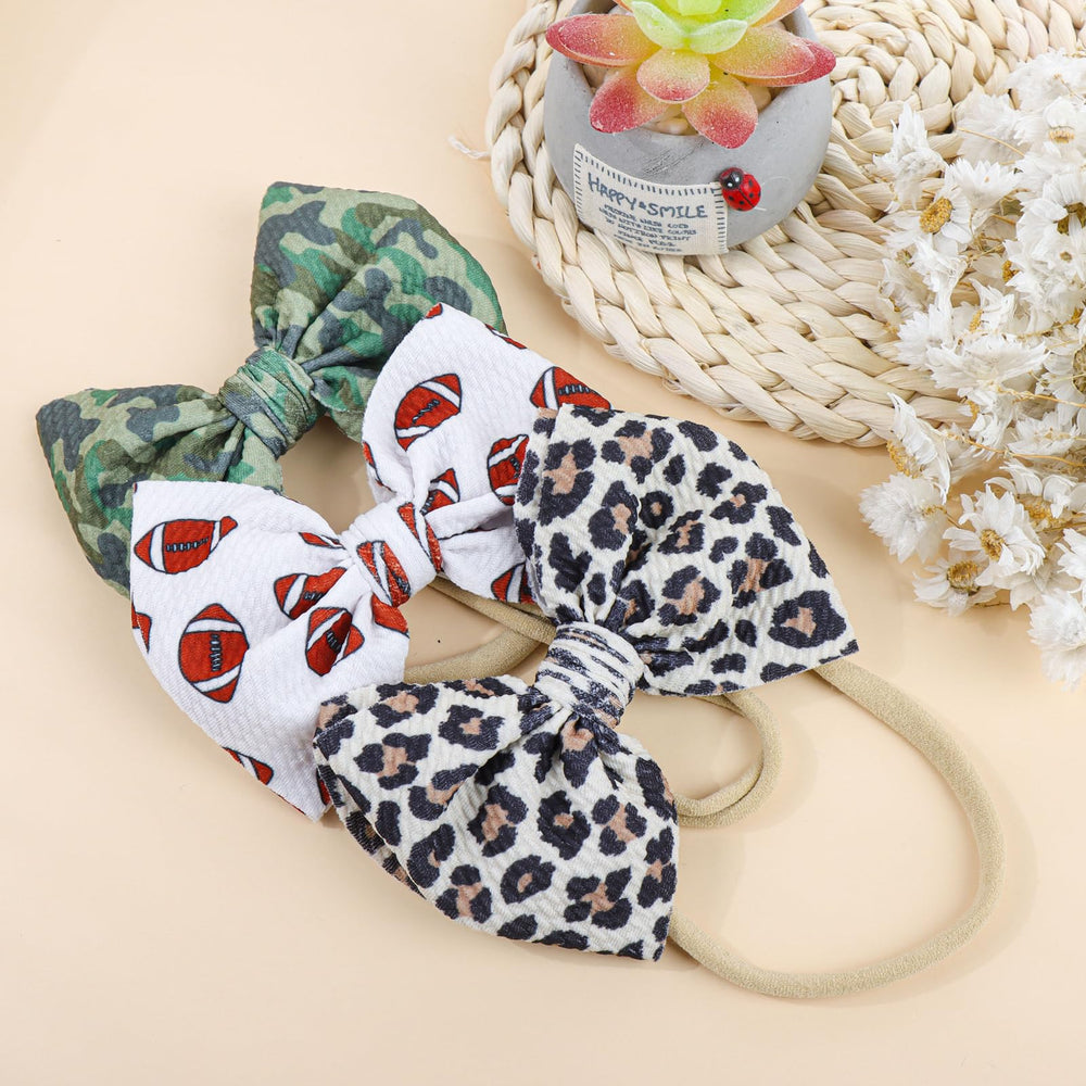 YanJie sporty bow headband style suitable for active babies.
