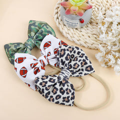 YanJie sporty bow headband style suitable for active babies.