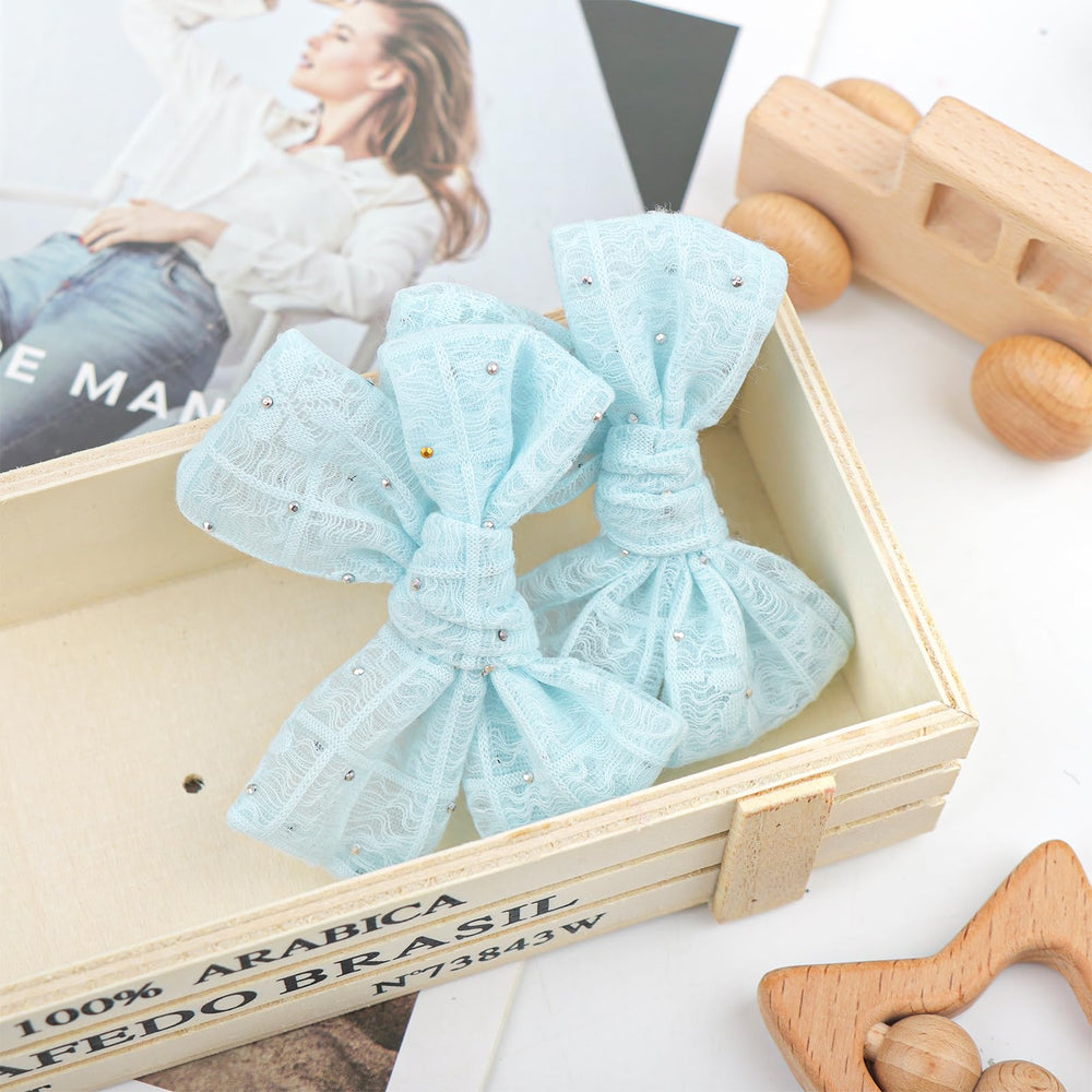YanJie lace bow texture closeup shows soft detail and shine.