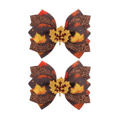 Yanjie maple glitter leaf bow clip adds shimmering fall detail.