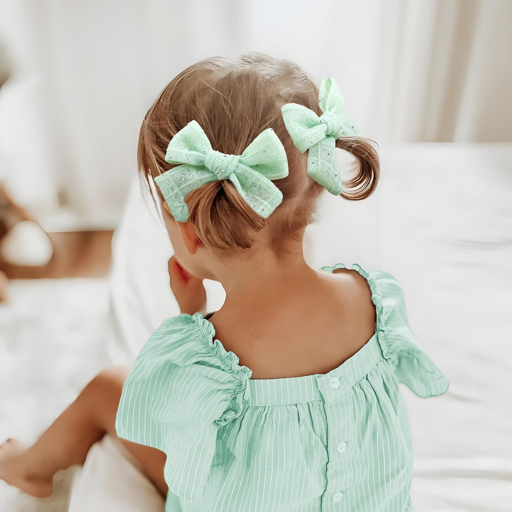 YanJie mint green lace bow clip side view showing secure alligator clamp