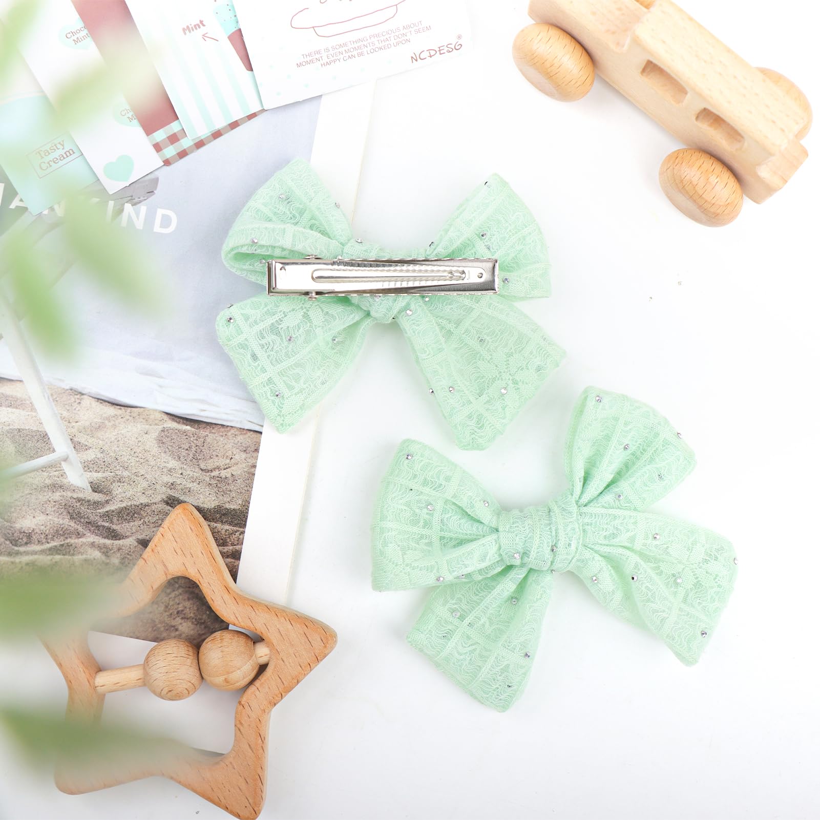 YanJie mint green lace bow clip worn in a hairstyle
